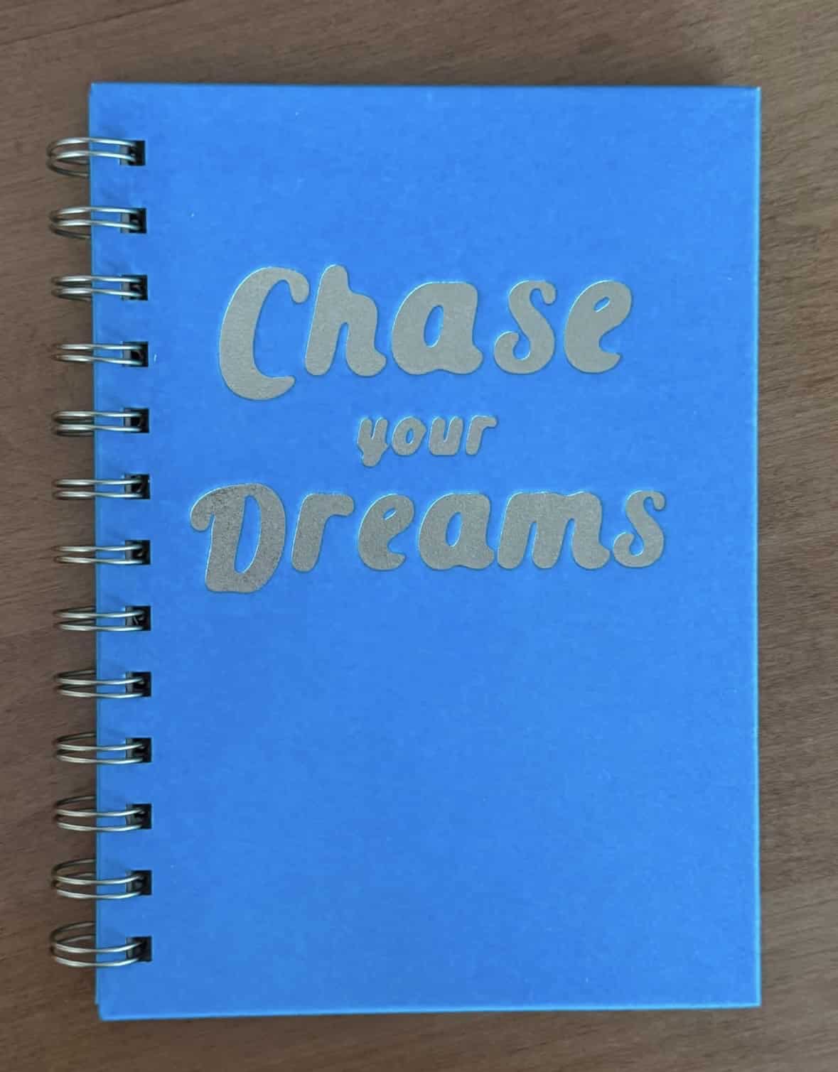 Chase your dreams written on a journal